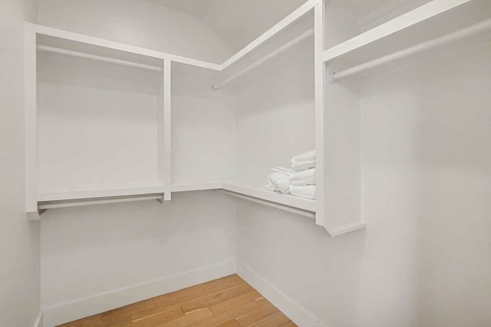 3rd Floor: 2nd Bedroom featuring a Queen bed, large walk-in closet, and an en-suite bathroom.