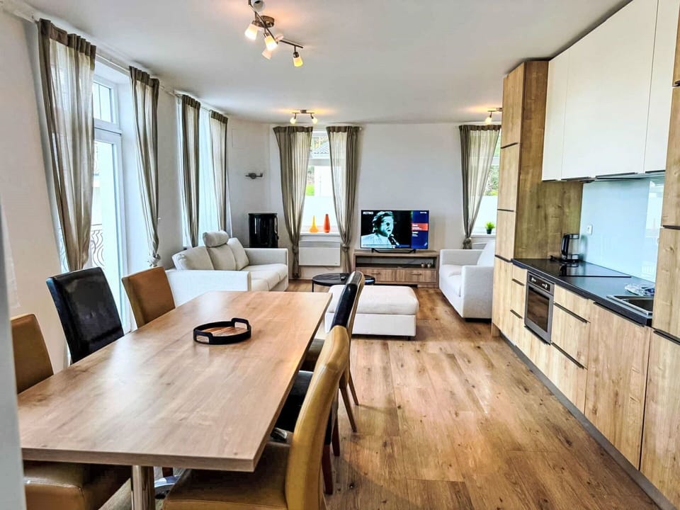 Furniture, Interior Design, Flooring, Wood, Floor, Wood Flooring, Ceiling, Room, Apartment, Chair