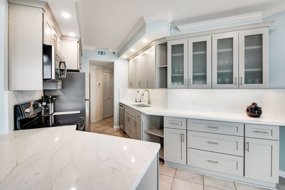 Brand new kitchen with a kitchen island and additional bar seating. 