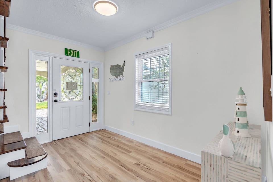 Front door and hallway to second floor