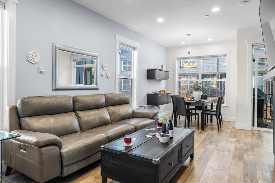 Bright living and dining area featuring a modern interior design.
