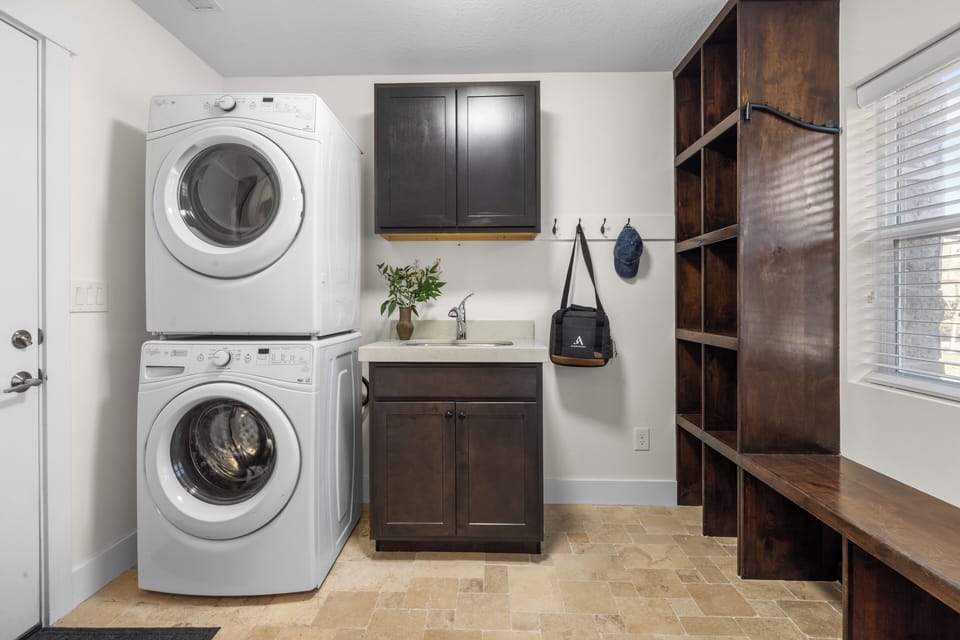 Laundry area with stacked washer and dryer.