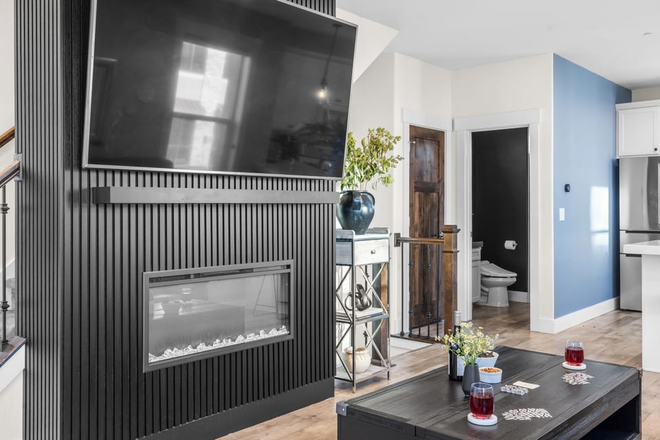 Living area with fireplace and TV.