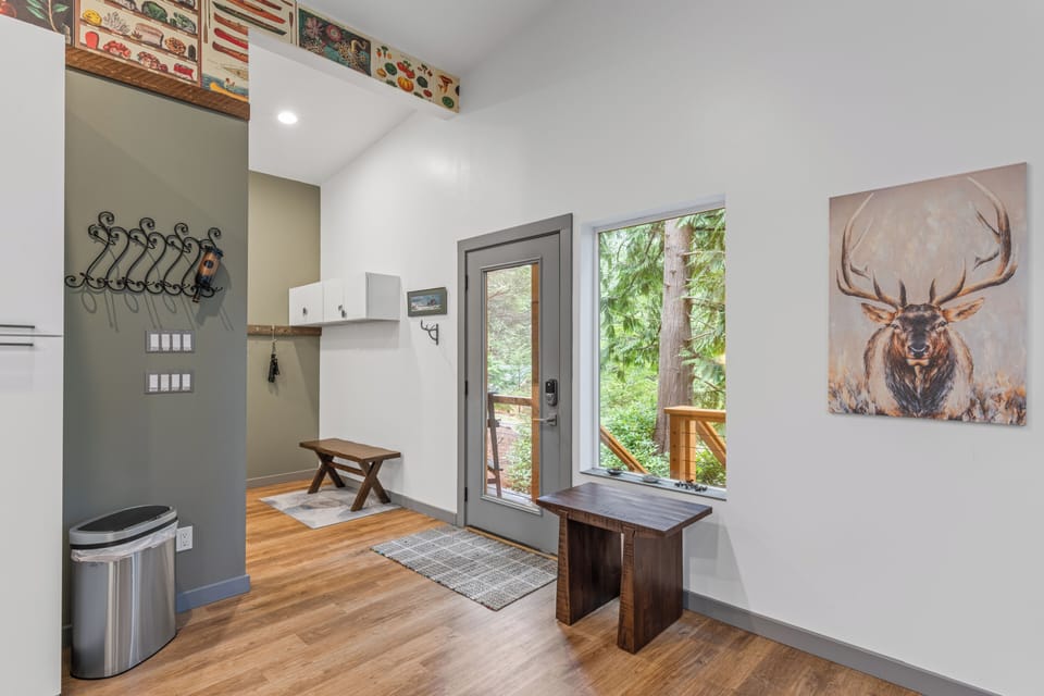 Entryway/mudroom area with exterior door and a small console table.