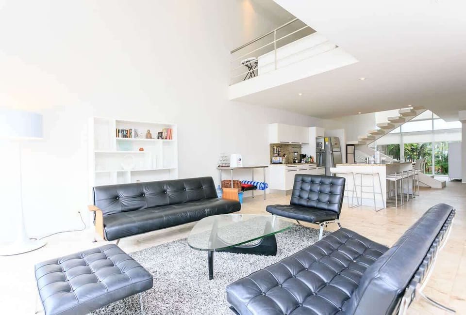 Formal sitting/living area with stylish modern furniture