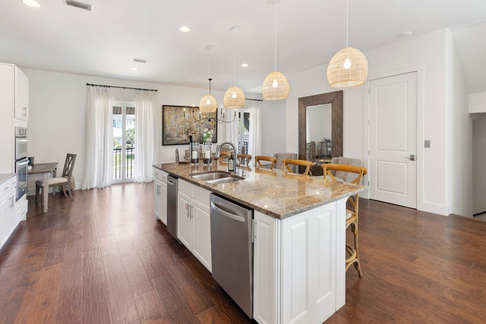 Your spacious kitchen flows seamlessly into the dining area, where granite countertops and modern appliances make cooking a joy.
