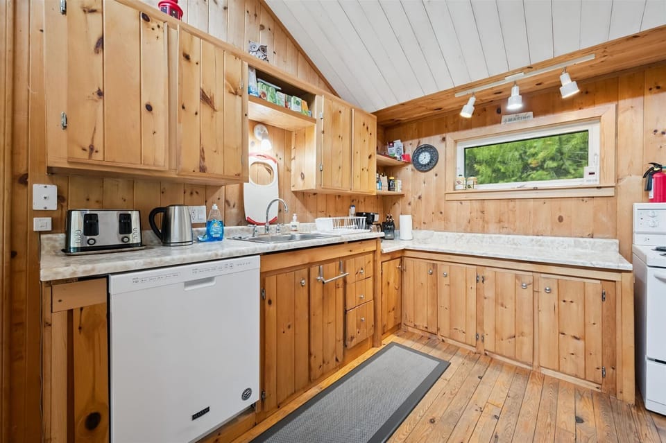 Bright and functional kitchen stocked with the essentials for preparing family meals, plus plenty of counter space for cooking and gathering.