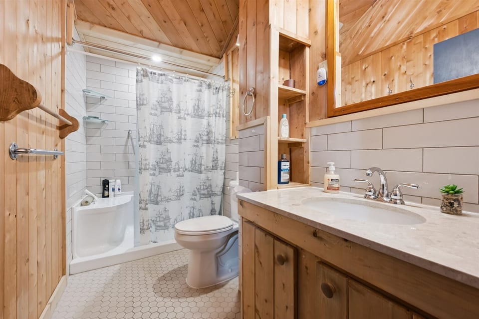 Clean, updated bathroom with a full shower and all essentials.