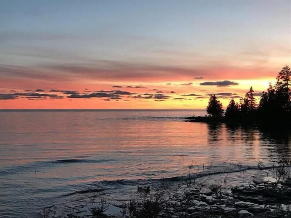 Stunning Lake Huron sunsets—unwind as the sky lights up over the water.