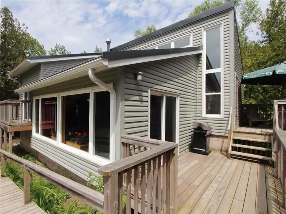 Wraparound deck with easy access to outdoor spaces—perfect for relaxing and entertaining.