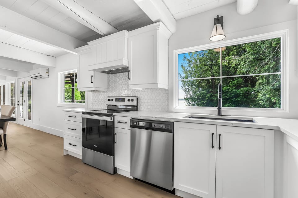 Bright kitchen with full size appliances and a great window view while you cook.