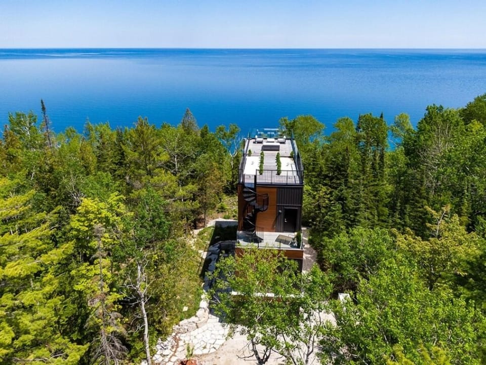 Clean lines and modern design rise effortlessly from the trees. Borchardt Lookout is a thoughtfully designed architectural home where nature remains the focal point.