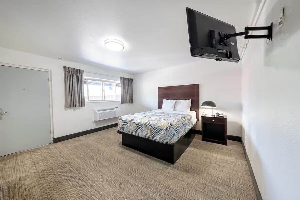 Stretch out with extra floor space and wall-mounted TV.