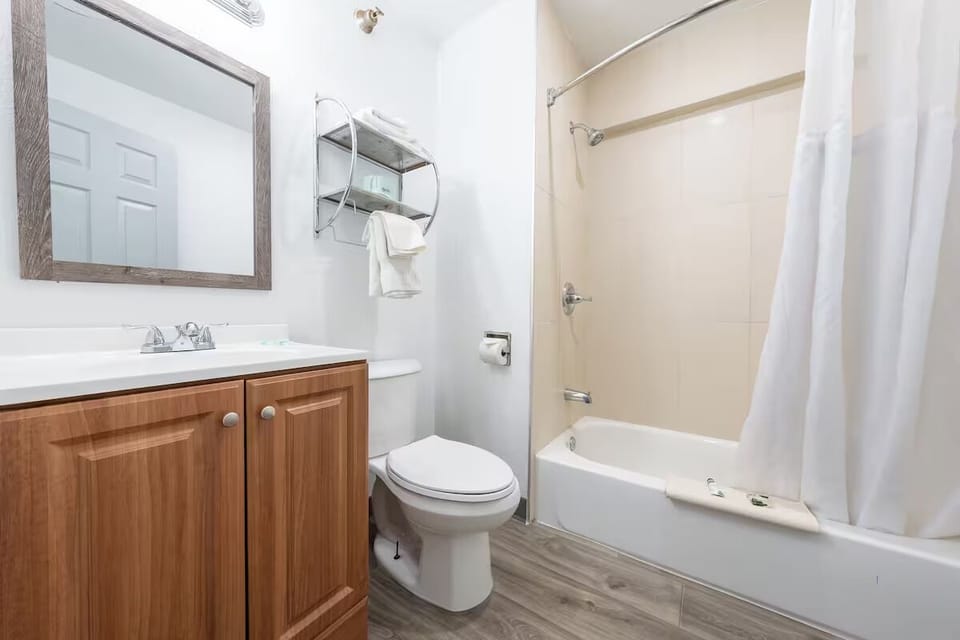 Recharge with a quick shower in a fresh, simple bath.