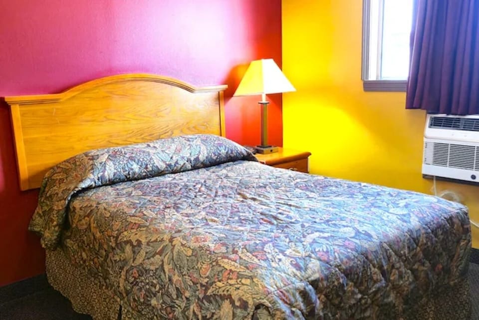 Unwind in a cozy bed with warm, cheerful colors.