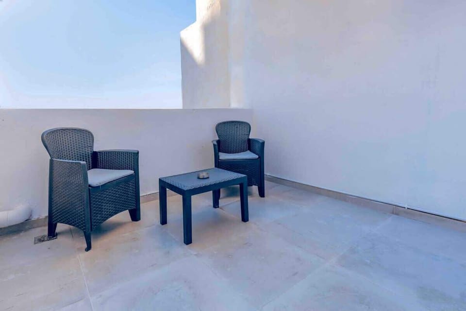 Step out of the bedroom and onto the terrace. It offers the perfect vantage point to soak in a breathtaking sunset, casting a golden glow over the cityscape. 
