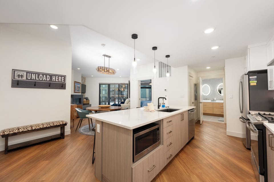 Your gourmet kitchen invites culinary adventures with sleek countertops, modern appliances, and an island perfect for gathering.