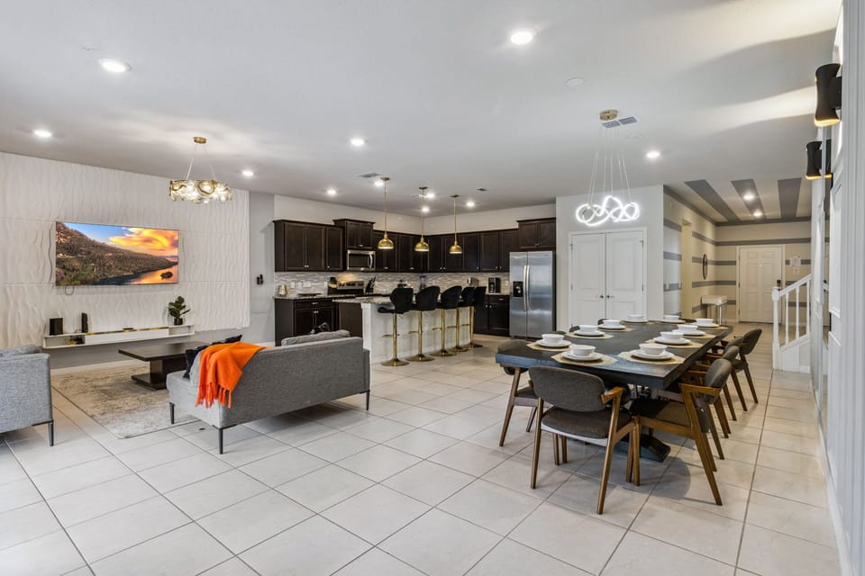 Large dining table plus bar seating ensures everyone can enjoy meals together.