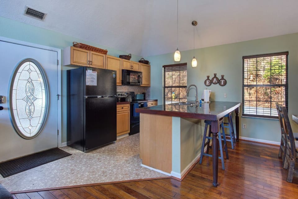You'll love cooking in this well-equipped kitchen featuring modern appliances, granite countertops, and a convenient breakfast bar for casual dining.