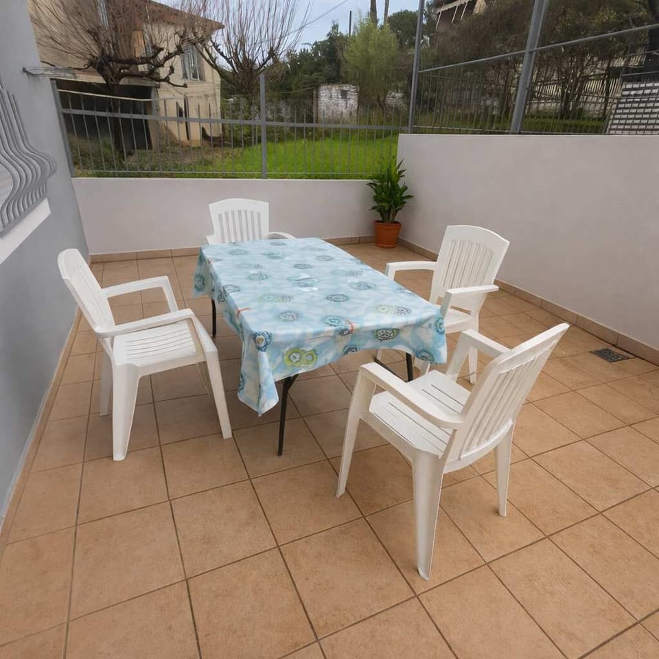 Patio seating area with table and chairs for meals or coffee outside