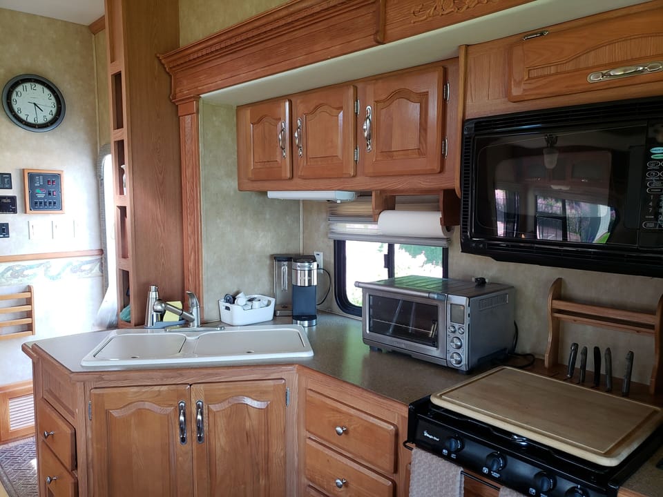 The Kitchen features a double sink, large fridge microwave, gas range and over.