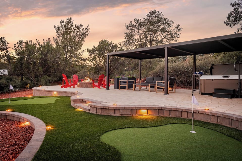 Terraced patio with putting green and pergola—family fun with fantastic views.