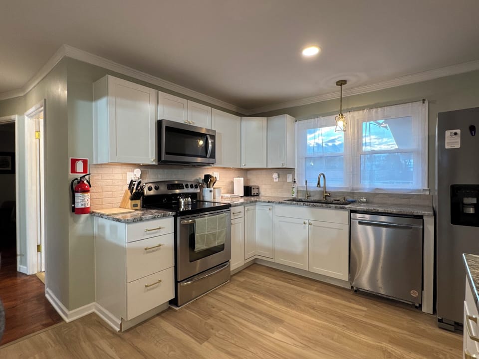 Very roomy kitchen with new appliances.