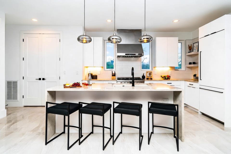 Step into this sleek and stylish kitchen, perfect for culinary adventures during your Nashville getaway! Enjoy upscale amenities and spacious seating, making it ideal for large groups. Experience Nashville in luxury with Misfit Homes. Book now!