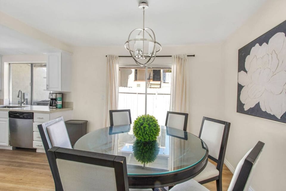Dining area with table seating for six guests.