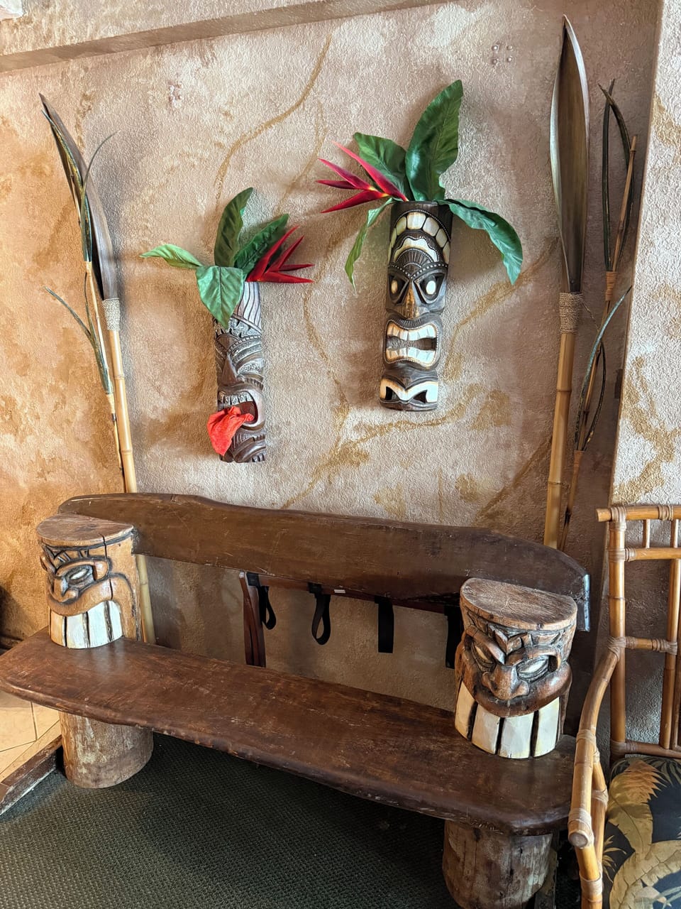 A cozy spot accented with authentic hand-carved Tiki masks.