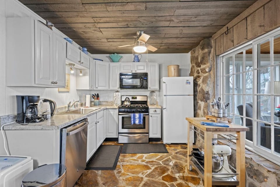 Spacious full kitchen with gas range—perfect for cooking bigger meals.
