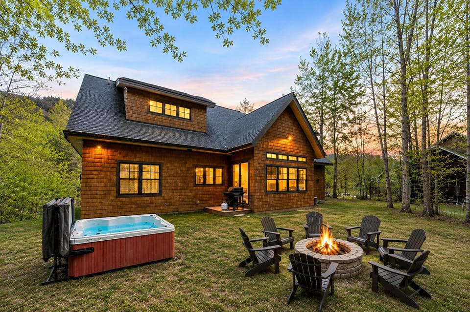 Cozy cabin retreat with hot tub, fire pit, and serene wooded setting