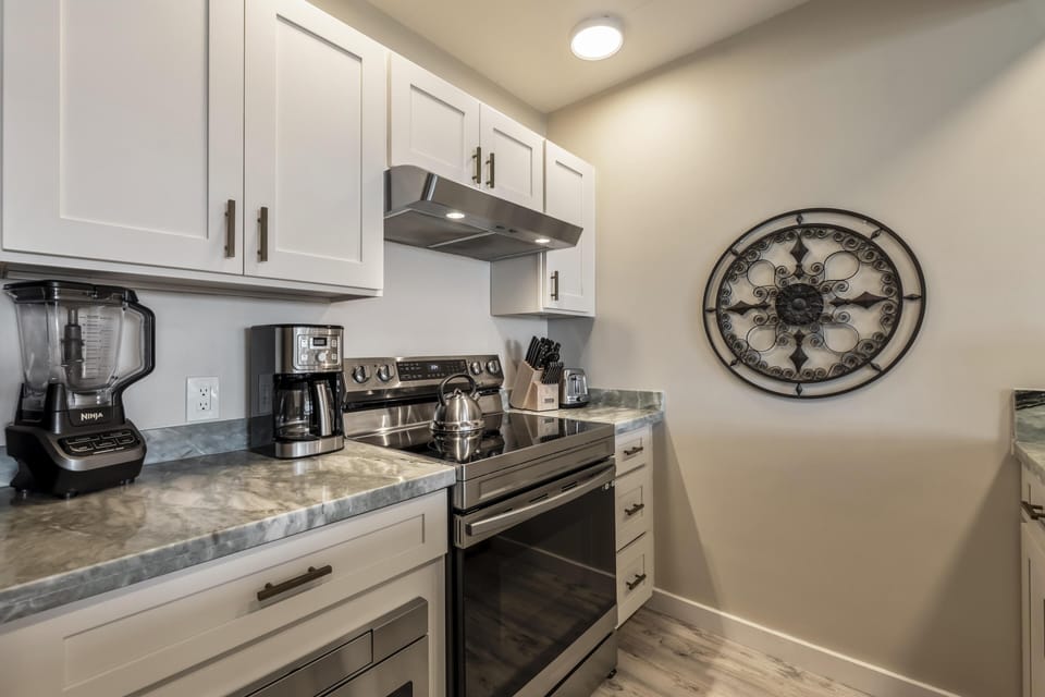 Modern kitchen with sleek appliances and cozy ambiance