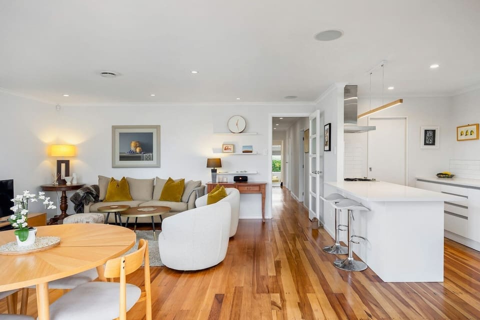 Open plan living with fully equipped kitchen, dining and lounge area, all opening out to the deck and lawn