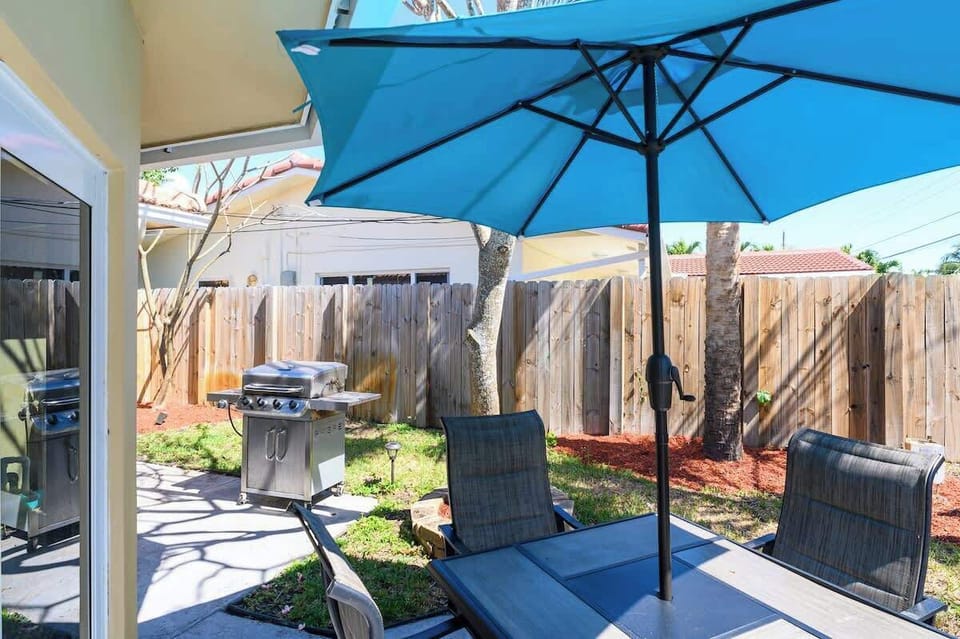 "Grill, chill, and dine outdoors in this cozy fenced patio—perfect for family BBQs, group hangs, or relaxing vacation vibes. Your Airbnb escape starts here!"