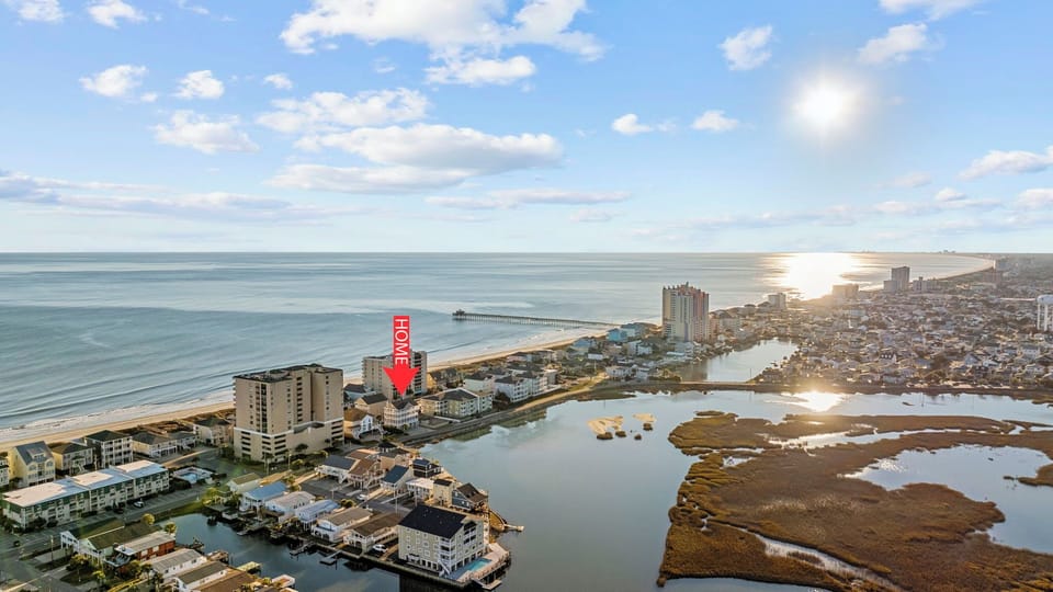 Nestled between ocean and marsh, just steps from Cherry Grove Beach.
