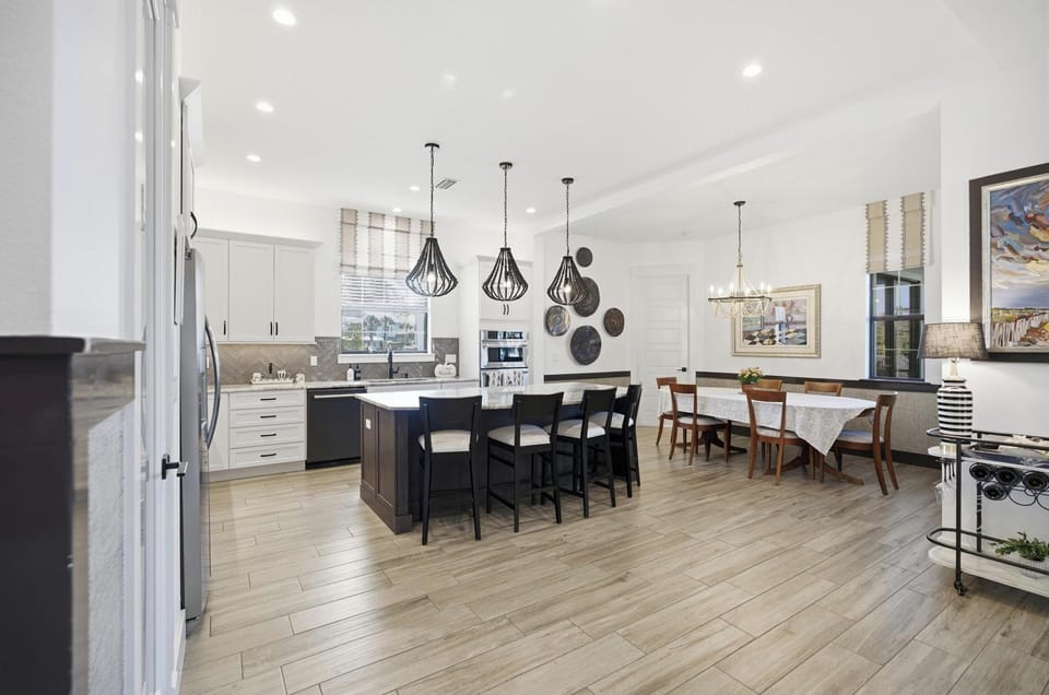 Open-concept gathering space for the whole crew 🍽️✨
A bright chef’s kitchen, oversized island seating, and a spacious dining area make it easy to cook, connect, and linger over long meals—this is where vacation memories get made.

