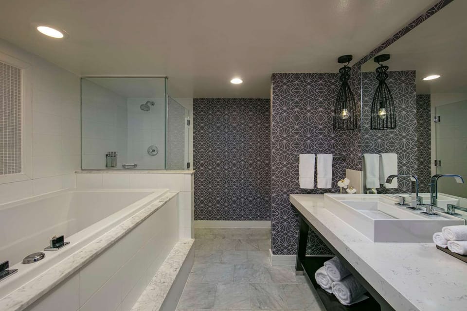 Refresh in a spa-like bath with soaking tub and glass shower.