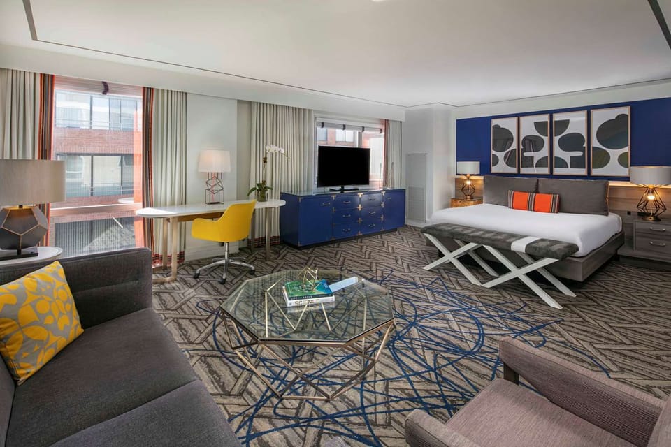 Unwind in a stylish suite with lounge seating and king bed.