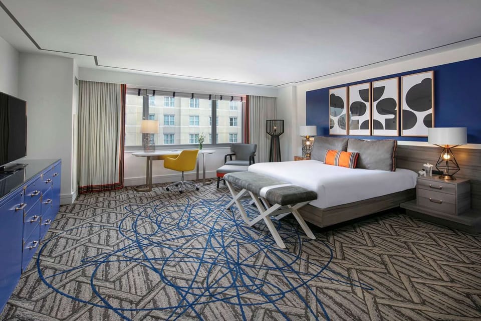 Unwind in a spacious king room with calming city views.
