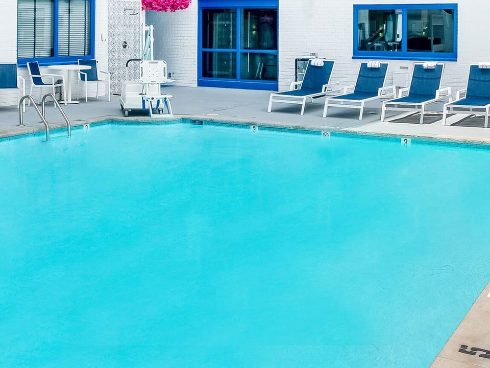 Soak up sunshine poolside in a public onsite pool.