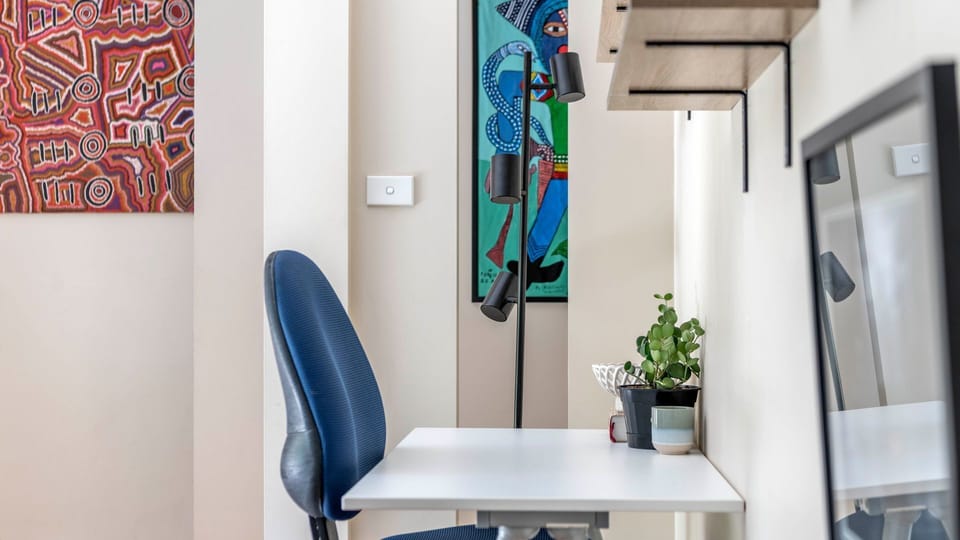 Bright home office with leafy views—perfect for work-from-home days.