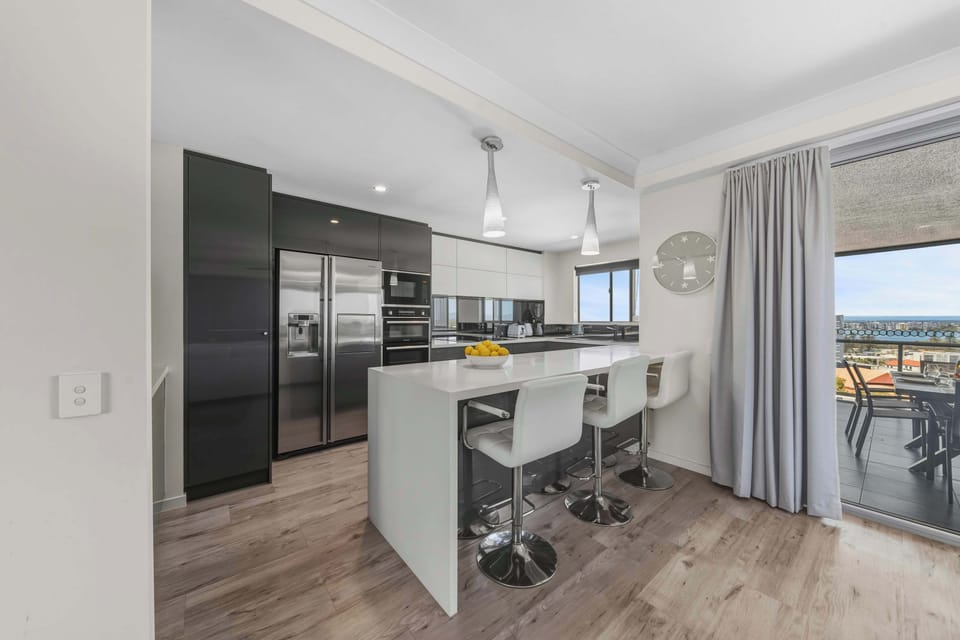 Cook and gather with ease in the sleek, well-appointed kitchen, thoughtfully designed for effortless stays.