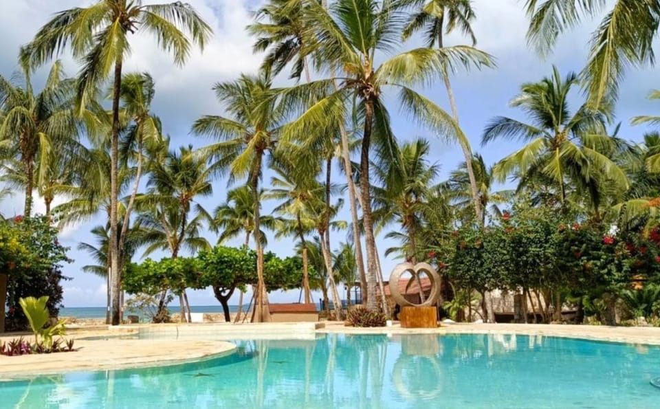 Stretch out beside turquoise water with ocean breezes nearby.