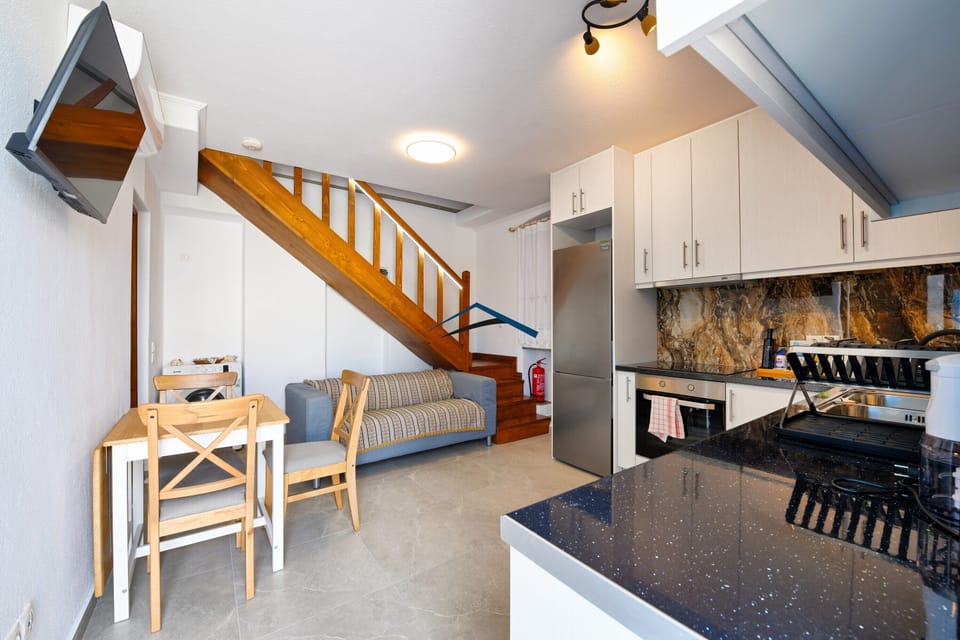 The kitchen, sitting and dining area