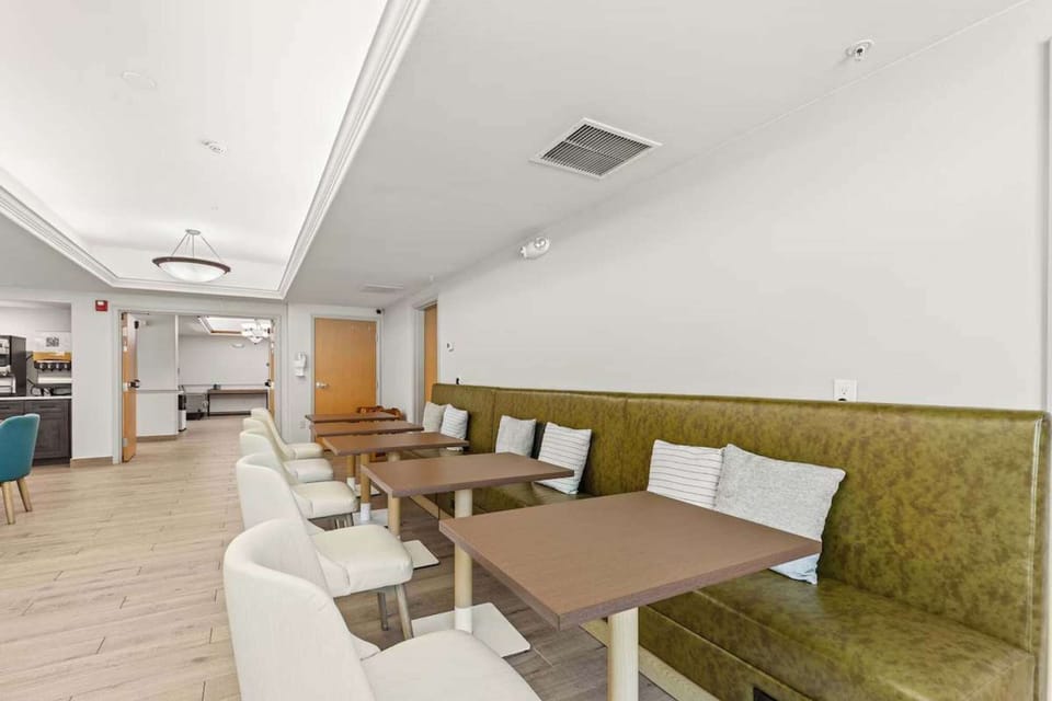 Dining area with booth seating and soft pillows