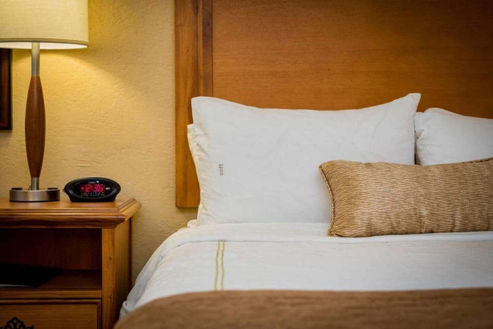 Alarm Clock and Queen Bed