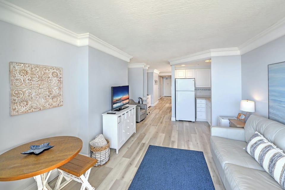 Bright living space with flat-screen TV