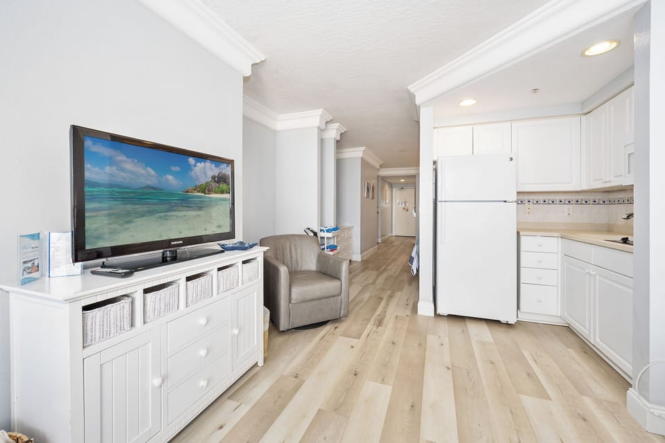 Bright living space with flat-screen TV