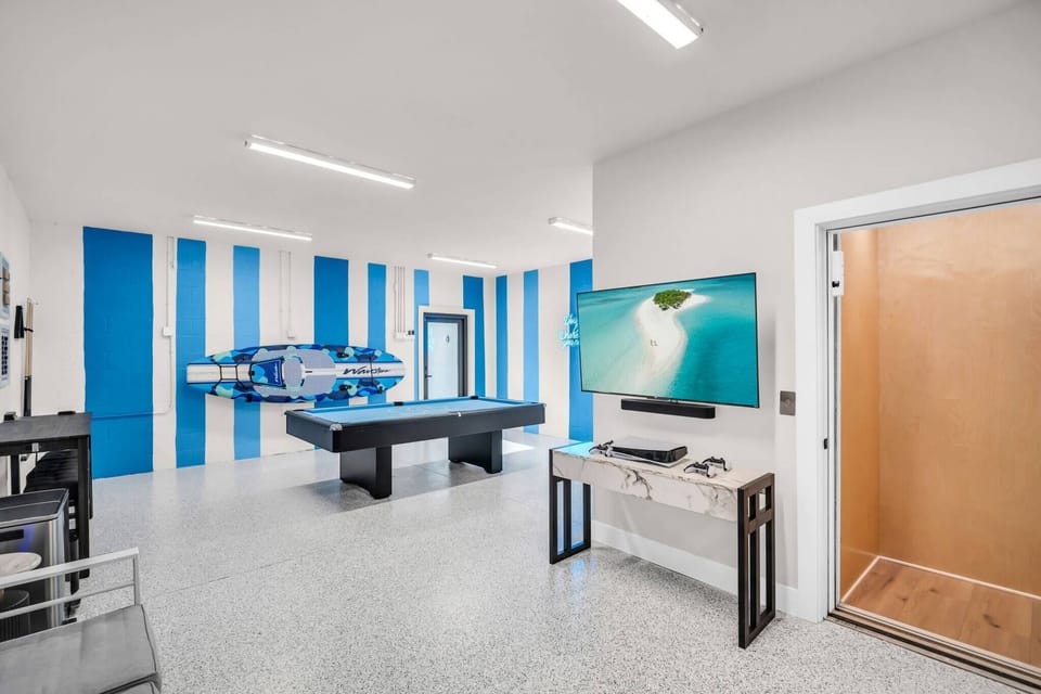 Ultimate game room. Pool table, Play Station, Basketball, Darts, Magnetic Board Games, Roku TV and a Sonos Sound System! Elevator access for all 3 floors.